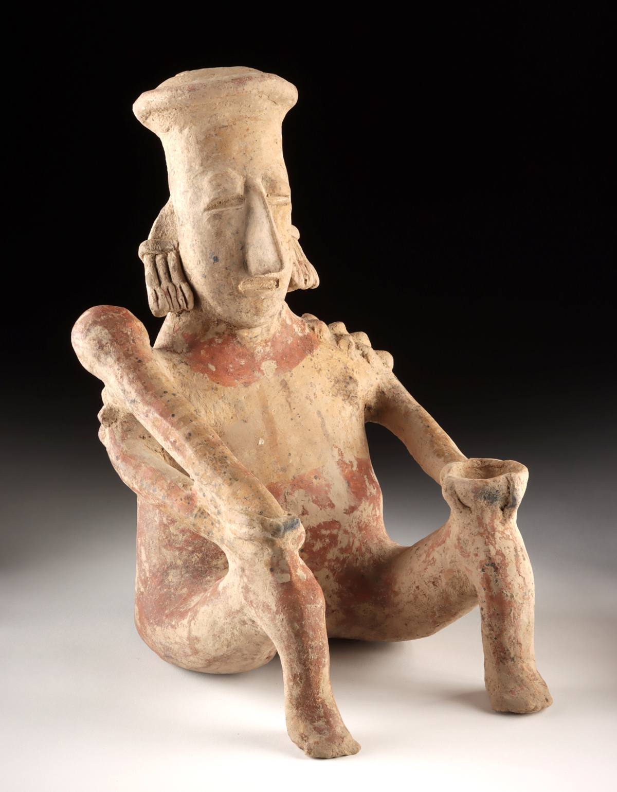 Lot 179, Auction 3/19/2026: Large Jalisco Pottery Seated Male Figure w/ Club