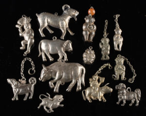 Lot 54, Auction 3/19/2026: Chinese & Mongolian Silver Charms of Figures +  Animals