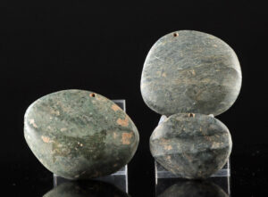 Lot 191, Auction 3/19/2026: Three Maya Stone Arrow Shaft Straightener Pendants