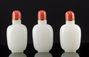 Lot 40a, Auction 3/19/2026: Three Matching Chinese Opaque White Glass Snuff Bottles