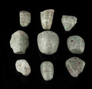 Lot 158, Auction 3/19/2026: Nine Guerrero Mezcala Greenstone Head Amulets