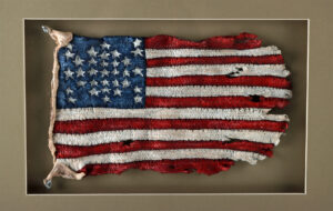 Lot 366, Auction 3/19/2026: Patrick Amiot Mixed Media Relief - Tattered Flag