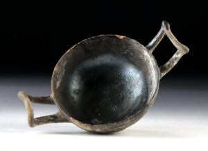 Lot 110, Auction 3/19/2026: Greek Campanian Blackware Stemless Kylix w/ Shell Motif