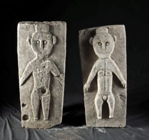Lot 11a, Auction 3/19/2026: Two Sumatra Stone Figural Plaques - Nude Male & Female