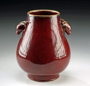 Lot 191, Auction 4/20/2026: Qing Porcelain Hu Vase - Sang de Boeuf w/ Stag Handles