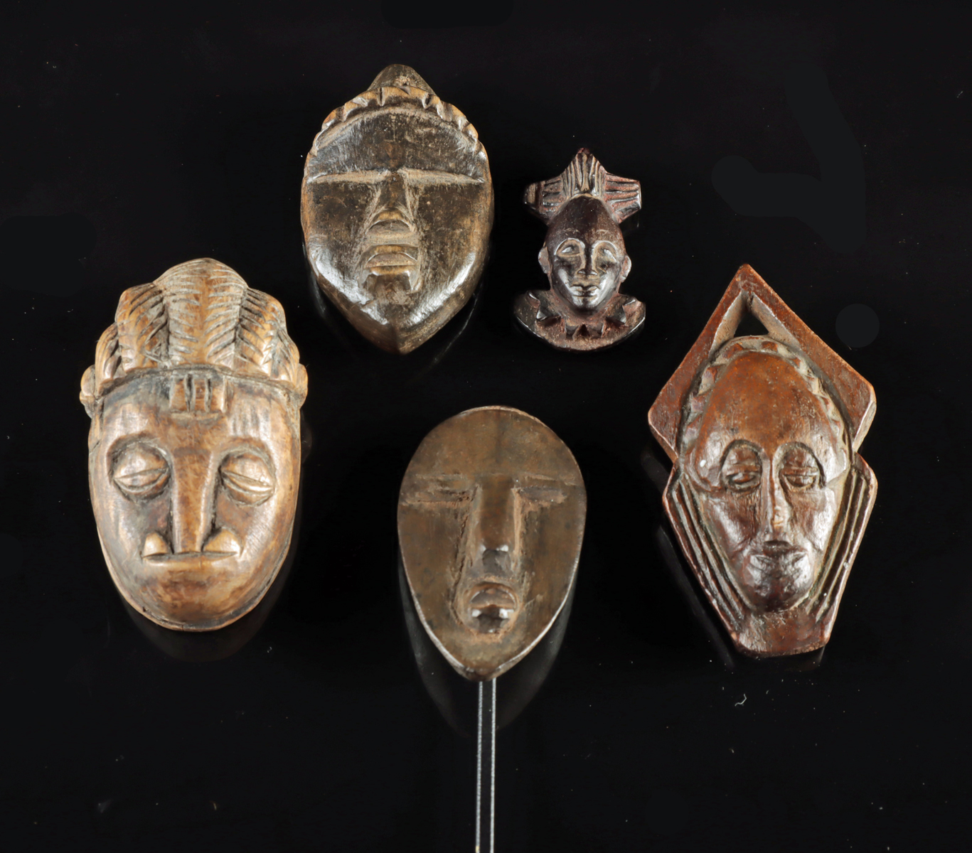 Lot 74b, Auction 4/12/2026: Five Miniature West African Wood Face Masks - Dan Ma Go
