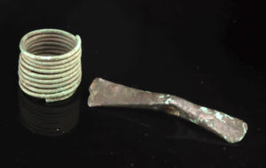 Lot 156a, Auction 4/20/2026: Bronze Age Copper Votive Axe Head & Brass Hair Coil