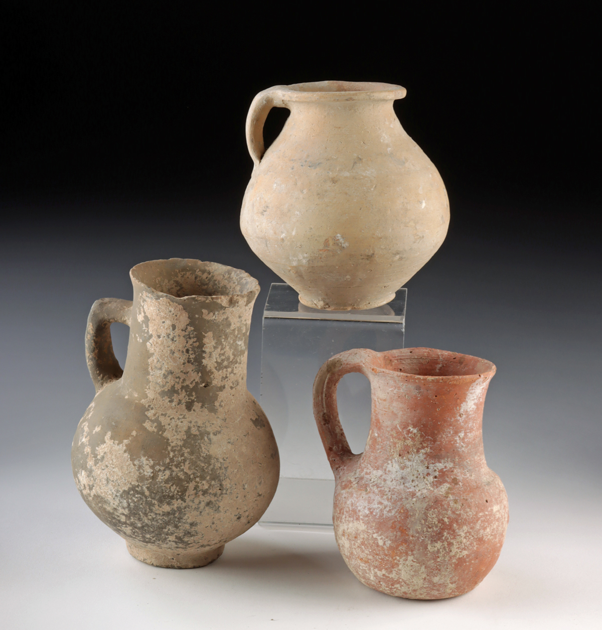Lot 155, Auction 4/3/2026: Three Iron Age to Roman Holyland Pottery Pitchers